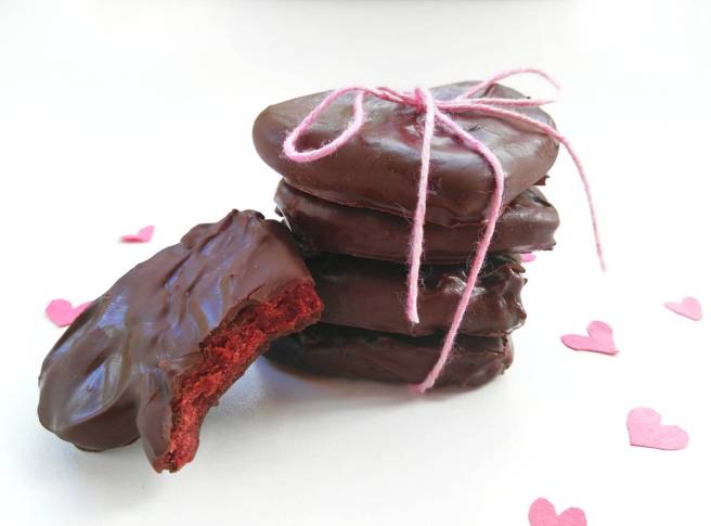 chocolate covered red velvet cookie dough hearts stacked