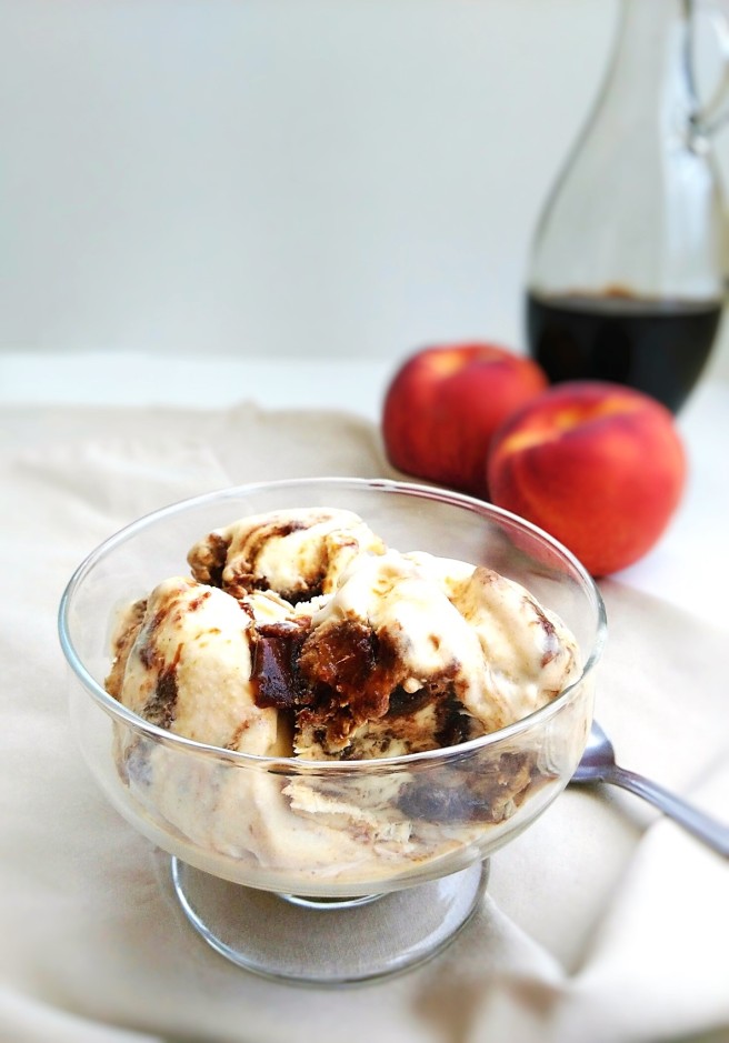 vanilla ice cream with balsamic caramelized peach swirl in a bowl